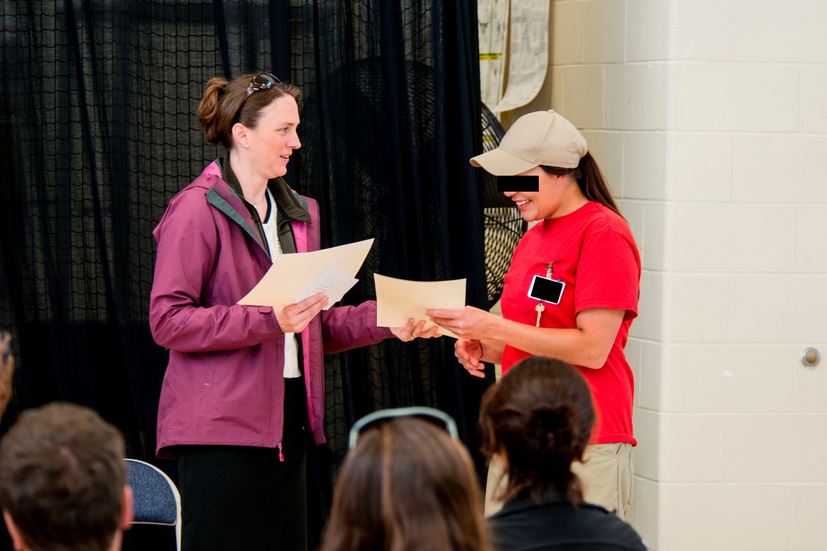 Dr. Carri LeRoy presents a certificate to an incarcerated student at the Washington Correctional Center for Women in Gig Harbor, WA. 