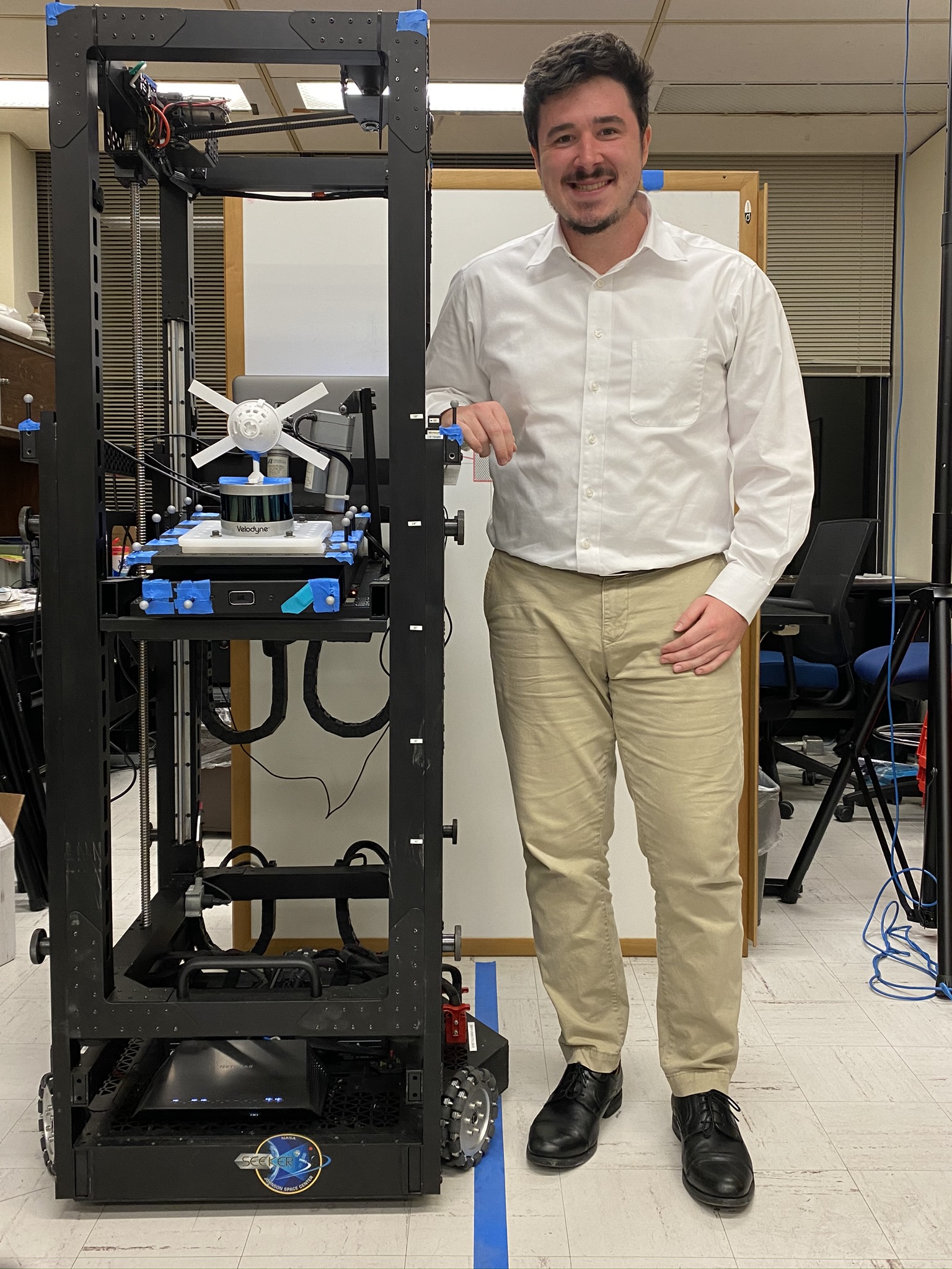 ARCS Scholar Samuel Buckner prepares to perform closed-loop testing of the Rendezvous Operation Sensor & Imagery Evaluator (ROSIE) robotic testbed.