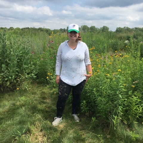 Portrait of ARCS Foundation Scholar Alum Becky Barak standing in a field 