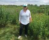Portrait of ARCS Foundation Scholar Alum Becky Barak standing in a field 